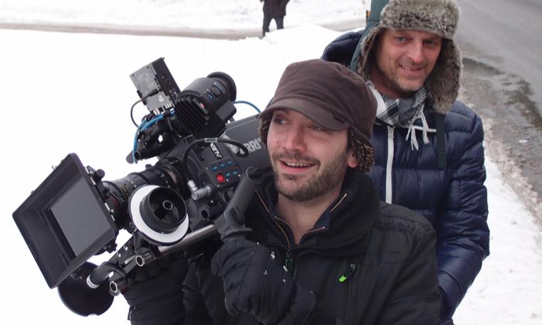 man holding cinema camera