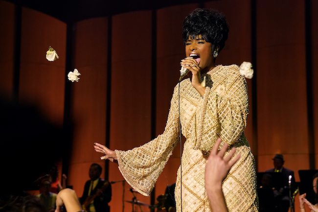 woman singing on stage