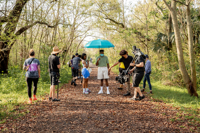 crew on set filming actor