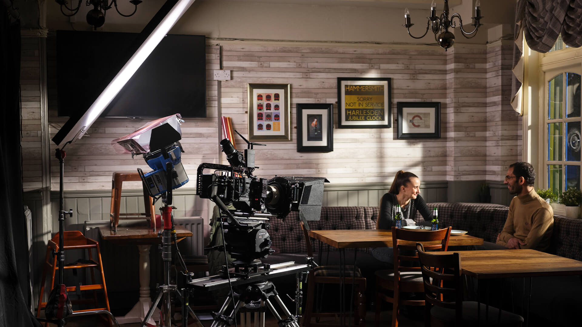 couple in restaurant lit by large bounce light